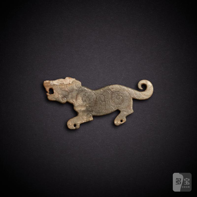 A celadon jade 'tiger' pendant, Western Zhou dynasty or later | 西周或更晚 青玉虎紋珮
